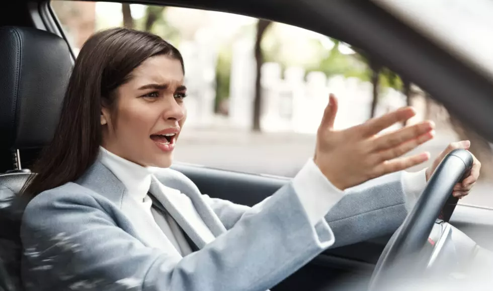 Annoyed,Businesswoman,Stuck,In,Traffic,On,Her,Commute.,Angry,Female